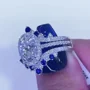Ovalschnitt Diamantweiß Saphirblau 925er Sterlingsilber Einlege Halo Trauring-Set