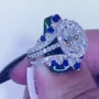 Ovalschnitt Diamantweiß Saphirblau 925er Sterlingsilber Einlege Halo Trauring-Set