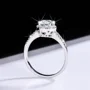 Rundschliff Moissanite Diamantweiß 925er Sterlingsilber Halo Verlobungsring